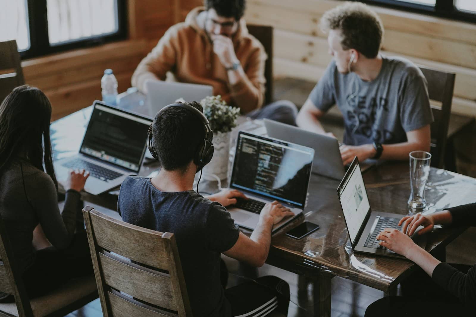 Developers collaborating on laptops